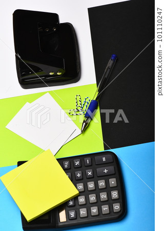 Calculator, hole punch, business cards, note paper, paper clips, pen Calculator, hole punch, business cards, note paper, paper clips, pen 101110247