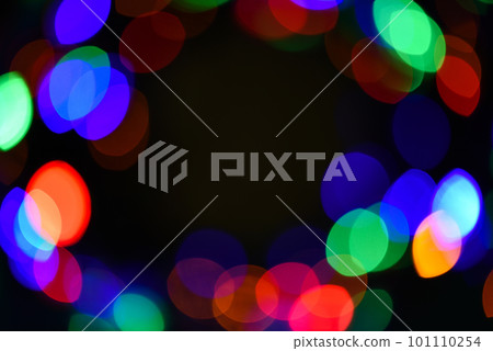 Defocused light of colorful garland. Festive backdrop with colorful lights. Bright and festive atmosphere of coming holiday. Abstract colorful bokeh background. Christmas decorations concept Defocused light of colorful garland. Festive backdrop with colorful lights. Bright and festive atmosphere of coming holiday. Abstract colorful bokeh background. Christmas decorations concept 101110254
