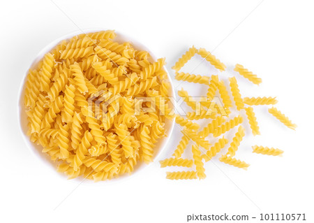 Raw pasta in bowl isolated on white background Raw pasta in bowl isolated on white background 101110571