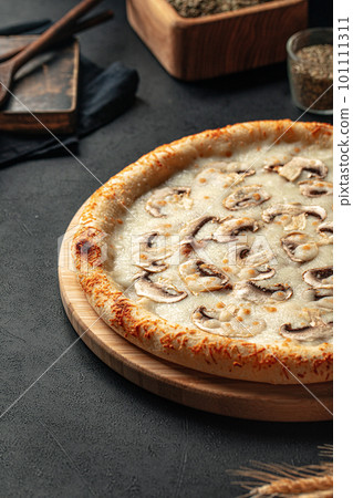 Freshly baked pizza with mushrooms and cheese Freshly baked pizza with mushrooms and cheese 101111311