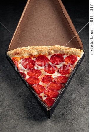 Take away box with slice of giant pepperoni pizza Take away box with slice of giant pepperoni pizza 101111317