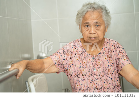 Asian senior woman patient use toilet bathroom handle security in nursing hospital, healthy strong medical concept. 101111332
