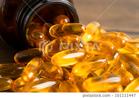 Fish oil Omega 3 capsules vitamin with EPA and DHA isolated on white background. Fish oil Omega 3 capsules vitamin with EPA and DHA isolated on white background. 101111447