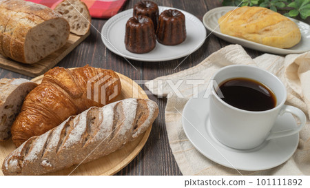 Bread, canelé and coffee Bread, canelé and coffee 101111892