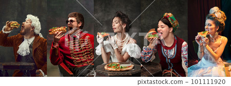 Fast food. Medieval men and women in royal clothes posing with junk food against dark vintage background Fast food. Medieval men and women in royal clothes posing with junk food against dark vintage background 101111920