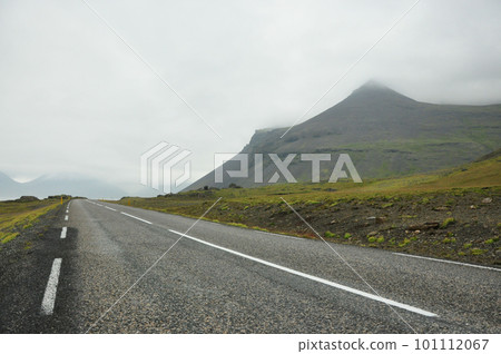 Coastal road in Iceland leading through mountains Coastal road in Iceland leading through mountains 101112067