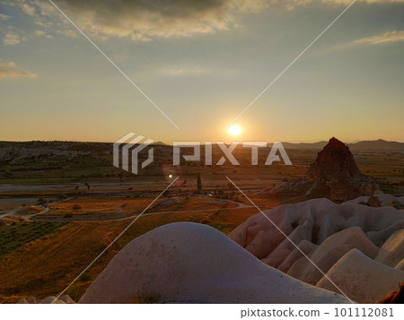 Sunset behind the Sandstone hills of Cappadocia in Turkey Sunset behind the Sandstone hills of Cappadocia in Turkey 101112081