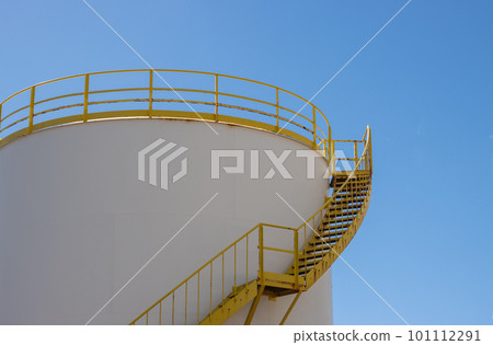 White tank with yellow details, blue sky White tank with yellow details, blue sky 101112291