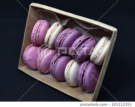 Cardboard box with Macaroon cookies. Colorful almond sweet cookies. Cardboard box with Macaroon cookies. Colorful almond sweet cookies. 101112351