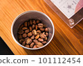 Coffee beans in a cup 101112454