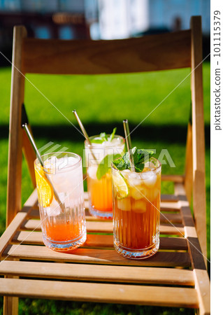 Summer cocktails. Alcoholic cocktail with ice and citrus fruits. Summer cocktails. Alcoholic cocktail with ice and citrus fruits. 101115379