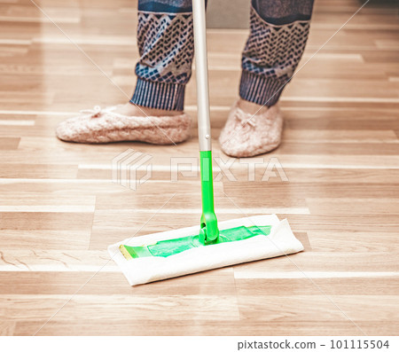 Woman cleaning floor using mop at home, swob, house work, closeup 101115504