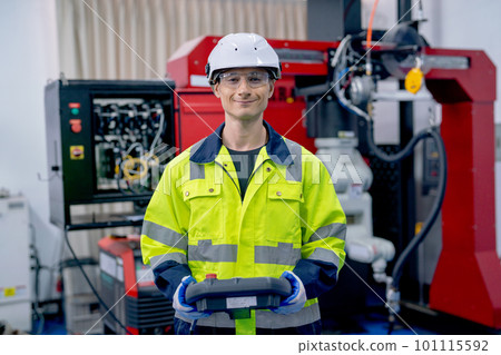 Portrait of professional technician or engineer hold controller and look at camera with smiling Portrait of professional technician or engineer hold controller and look at camera with smiling 101115592