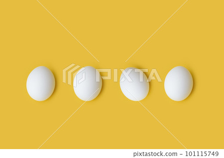 White eggs on yellow background 101115749
