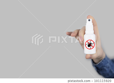 Tick repellant. Insect protection. Girl holds a spray on a white background that will protect against ticks. Repelling blood-sucking insects. Tick repellant. Insect protection. Girl holds a spray on a white background that will protect against ticks. Repelling blood-sucking insects. 101115920