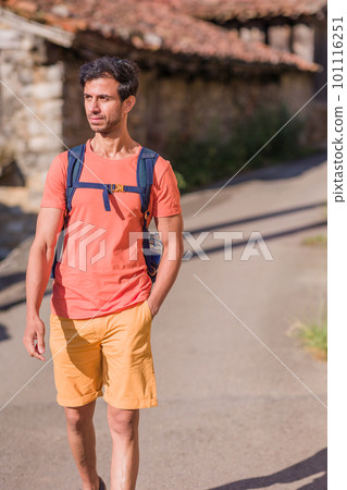 Indian mid man in Asturias summer vacation. Casual hiker adventure with backpack. Ecotourism 101116251
