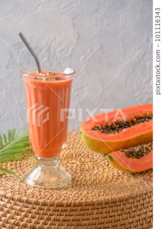 Papaya lassi or smoothie on gray background. 101116343
