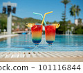 Relax by the pool. Summer vibrant cocktails with a straw sit by the pool. 101116844
