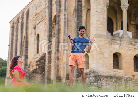 Indian model, mature man dancing Bollywood with smartphone music. Europe travel rhythm on casual. 101117652