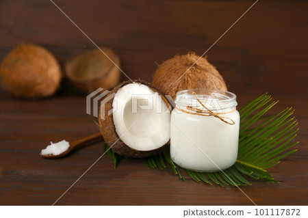 Composition with organic coconut oil on wooden table. Healthy cooking Composition with organic coconut oil on wooden table. Healthy cooking 101117872