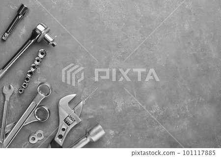 Auto mechanic's tools on grey stone table, flat lay. Space for text Auto mechanic's tools on grey stone table, flat lay. Space for text 101117885