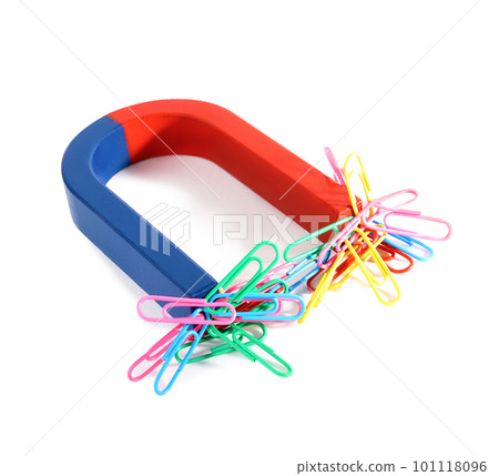 Magnet attracting paper clips on white background Magnet attracting paper clips on white background 101118096