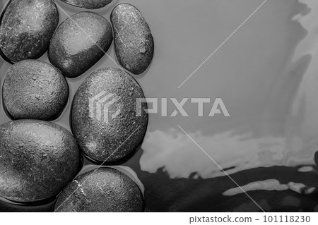 Stones in water, top view with space for text. Zen lifestyle Stones in water, top view with space for text. Zen lifestyle 101118230
