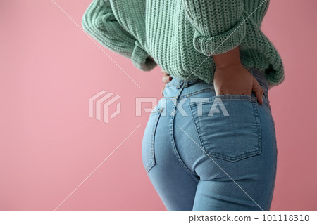Woman wearing jeans on pink background, closeup. Space for text 101118310