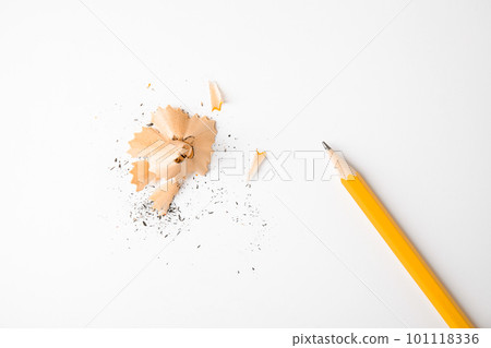 Pencil and shavings on white background, top view 101118336