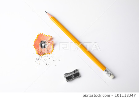 Graphite pencil, shaving and sharpener on white background, top view Graphite pencil, shaving and sharpener on white background, top view 101118347