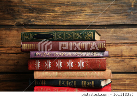 Collection of different books on wooden background 101118355