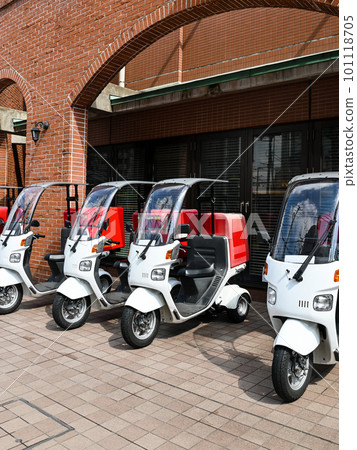 Delivery scooters lined up 101118705