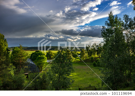 Condensing clouds on a summer day 101119694