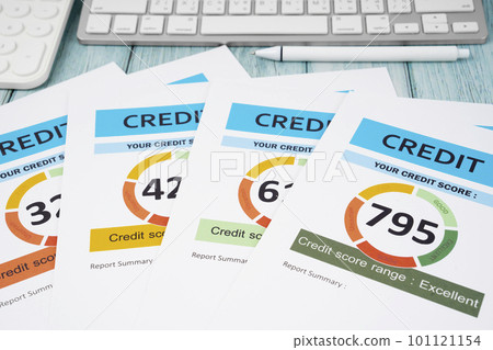 The Credit score report document and pen with calculator on the desk. 101121154