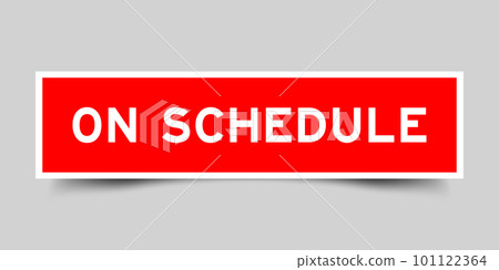 Red color square shape sticker label with word on schedule on gray background 101122364