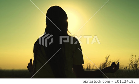 Yoga sunset girl sitting pose silhouette woman. sun hand exercise stretching sport park nature health breathe sky beach lifestyle pray. meditation unrecognizable activity position energy. yogi 101124183
