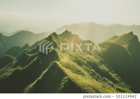 Beautiful sunrise over the green mountains in morning light with fluffy clouds on a bright blue sky. Nature freshness concept Beautiful sunrise over the green mountains in morning light with fluffy clouds on a bright blue sky. Nature freshness concept 101124942