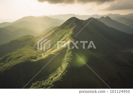 Beautiful sunrise over the green mountains in morning light with fluffy clouds on a bright blue sky. Nature freshness concept 101124950