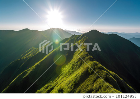 Beautiful sunrise over the green mountains in morning light with fluffy clouds on a bright blue sky. Nature freshness concept Beautiful sunrise over the green mountains in morning light with fluffy clouds on a bright blue sky. Nature freshness concept 101124955