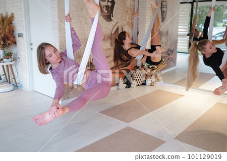 workshop of air yoga and stretching in yoga studio 101129019