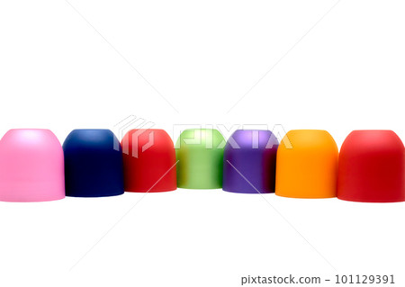 Multicolored bright cones cylinders caps and place for text on white 101129391