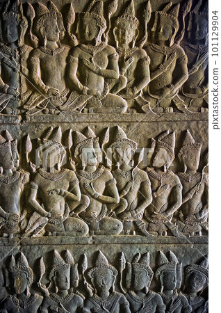 Characters carved in stone in Angkor Wat 101129904
