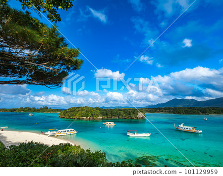 A boat floating in Kabira Bay 101129959