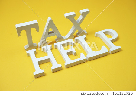 Tax Help alphabet letters on yellow background 101131729