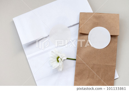 Round sticker mockup on gift white and kraft package, envelope with blank sticker, adhesive label 101133861