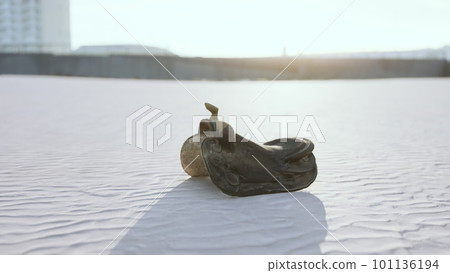 old horse saddle on the beach 101136194
