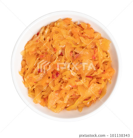 Kimchi, in a white bowl. Traditional Korean side dish, made of salted and fermented vegetables cabbage, carrots, radish and onions, seasoned with garlic, ginger and the Korean chili powder gochugaru. Kimchi, in a white bowl. Traditional Korean side dish, made of salted and fermented vegetables cabbage, carrots, radish and onions, seasoned with garlic, ginger and the Korean chili powder gochugaru. 101138343