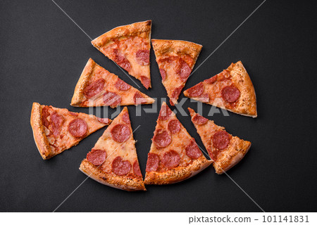 Delicious fresh pepperoni pizza with sesame seeds on the sides Delicious fresh pepperoni pizza with sesame seeds on the sides 101141831