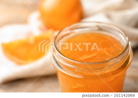 Homemade delicious orange jam on table, closeup view 101142069