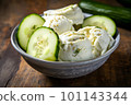 Bowl of ice cream with pickles on wooden table. Generative AI. 101143344